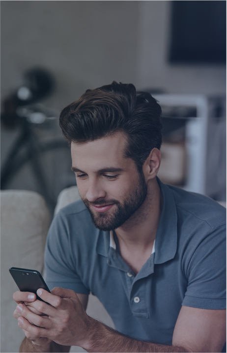 A young man is looking at his phone